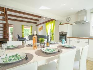 a kitchen and dining room with a table and chairs at Holiday Home Les Aloès by Interhome in Sainte-Marie-la-Mer