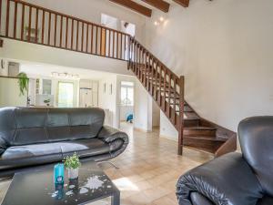 a living room with a couch and a staircase at Holiday Home Les Aloès by Interhome in Sainte-Marie-la-Mer