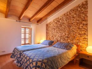 A bed or beds in a room at Holiday Home Can Xerret by Interhome