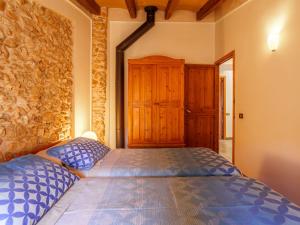 A bed or beds in a room at Holiday Home Can Xerret by Interhome