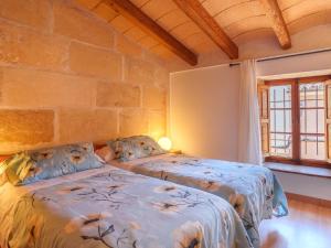 A bed or beds in a room at Holiday Home Can Xerret by Interhome