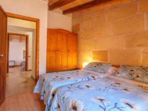 A bed or beds in a room at Holiday Home Can Xerret by Interhome