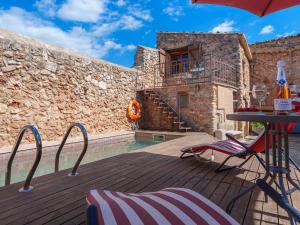 The swimming pool at or close to Holiday Home Can Xerret by Interhome