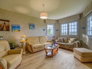 a living room with couches and a table at Apartment Le Moulin by Interhome in Saint-Philibert