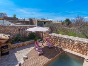 The swimming pool at or close to Holiday Home Can Xerret by Interhome