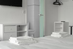 Uma cama ou camas num quarto em Hotel de la Bourse