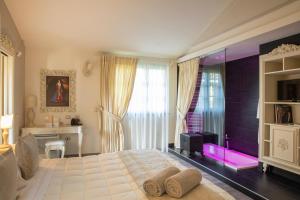 Postel nebo postele na pokoji v ubytování Relais Sassa al Sole