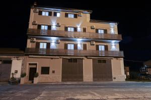 a tall building with a balcony on top of it at GREEN - Bed and Breakfast a Castrovillari in Castrovillari