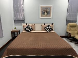เตียงในห้องที่ New Home บ้านเดี่ยว สร้างใหม่ ใกล้ทะเล ใจกลางเมืองระยอง