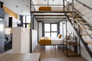 a bedroom with a bunk bed in a loft at Vip Apartments Valencia in Valencia