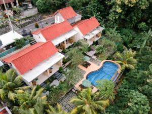 an aerial view of a house with a swimming pool at Arunika Cottage in Nusa Penida