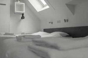 Uma cama ou camas num quarto em Hotel de la Bourse