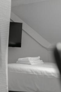 Uma cama ou camas num quarto em Hotel de la Bourse