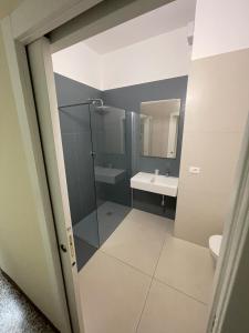a bathroom with a shower and a sink at Hotel Telstar in Rimini