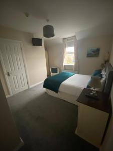 Ένα ή περισσότερα κρεβάτια σε δωμάτιο στο Suantrai Accommodation