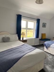 Ένα ή περισσότερα κρεβάτια σε δωμάτιο στο Suantrai Accommodation