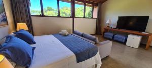 Кровать или кровати в номере Águas de Santa Bárbara Resort Hotel