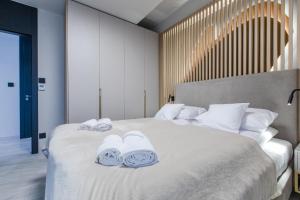 Postel nebo postele na pokoji v ubytování Resort Hevenia Rewal 8 + 38 fotografií