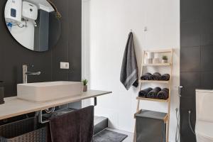 a bathroom with a sink and a mirror at Casa Turquesa in Tamaraceite +7 photos