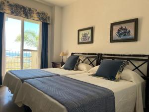 Posteľ alebo postele v izbe v ubytovaní Lyrioshomes Precioso Apartamento Puerto de Estepona