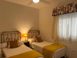 Posteľ alebo postele v izbe v ubytovaní Lyrioshomes Precioso Apartamento Puerto de Estepona