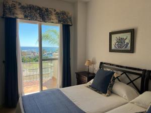 Posteľ alebo postele v izbe v ubytovaní Lyrioshomes Precioso Apartamento Puerto de Estepona