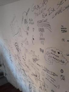 a white wall with writing on it at Piran Loft in Buenos Aires