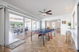 a living room with a ping pong table in it at Heated Pool, Ping Pong Table, Sleeps 10 - Villa Sunset Riverhouse in Cape Coral