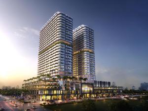 two tall buildings in a city with a street at Melaka Duplex Penthouse 3 Bedroom The Wave Residence 9pax in Melaka