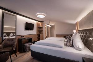 Postel nebo postele na pokoji v ubytování Alphotel Garni Salner