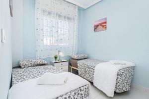 Posteľ alebo postele v izbe v ubytovaní Bungalow Sunrise Europa