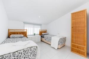 Posteľ alebo postele v izbe v ubytovaní Bungalow Sunrise Europa
