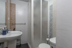 a bathroom with a sink and a toilet and a shower at tuGuest Santa Paula III Apartment in Granada