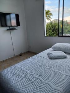 Снимка в галерията на Apartamento a 2 cuadras del estadio. в Кали