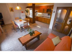 an overhead view of a living room and kitchen with a couch and table at Apartment Miranda in Slatine