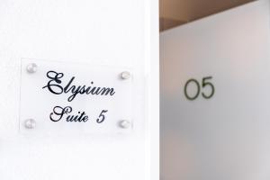 a white door with a sign that reads asylum rule at Mythical Spa Suite - GYM*Yoga Room*Pools in Protaras