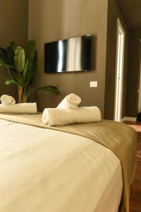 Posteľ alebo postele v izbe v ubytovaní Il Corso Comfort Rooms