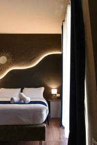 Posteľ alebo postele v izbe v ubytovaní Il Corso Comfort Rooms
