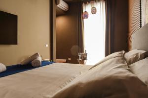 Posteľ alebo postele v izbe v ubytovaní Il Corso Comfort Rooms