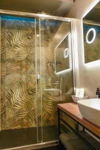 a bathroom with a shower and a sink at Il Corso Comfort Rooms in Rome