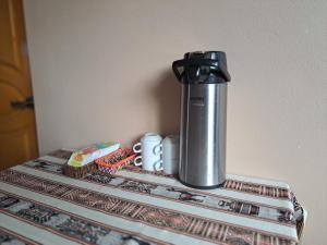 a thermos sitting on top of a table at Maychu's Albergue in Chincheros