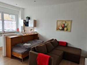 a living room with a couch and a desk at Erdgeschosswohnung in Marl in Marl