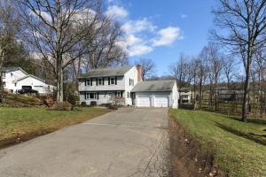 una casa blanca con una entrada delante de ella en Connecticut Vacation Home Rental with Private Pool! en Southington