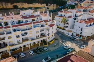 an aerial view of a city with buildings and cars at Sunny Duplex W/ Pool & Balcony by LovelyStay in Carvoeiro