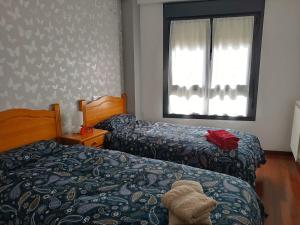 Łóżko lub łóżka w pokoju w obiekcie A Bruxo Fonte 8 pzs 2 baños Full Reg VUT38509