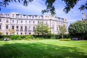a large building with a lawn in front of it at McIntosh Hall - Campus Accommodation in St. Andrews
