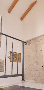 a swing in a room with a stone wall at Apartments Trabakul in Trogir