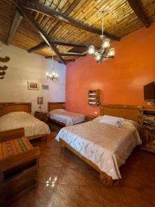 Postel nebo postele na pokoji v ubytování HOTEL El INDIO
