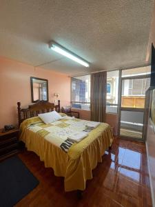 Postel nebo postele na pokoji v ubytování HOTEL El INDIO