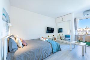 A bed or beds in a room at 797 HOLIDAY RENTALS - Espectacular estudio en Minerva